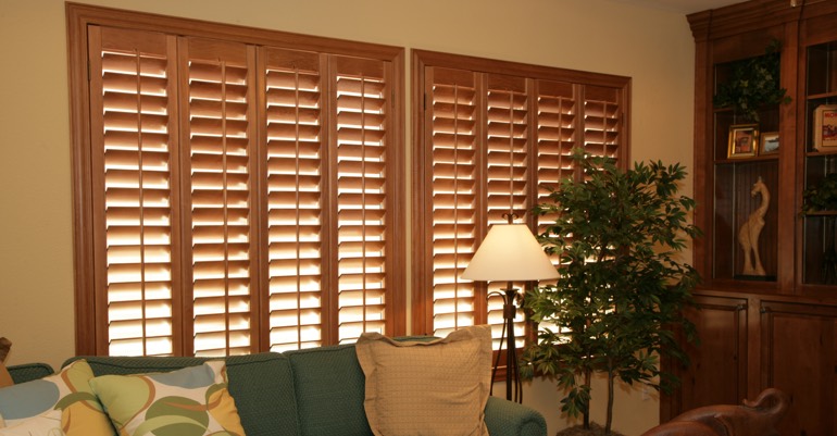 Natural wood shutters in Southern California living room.
